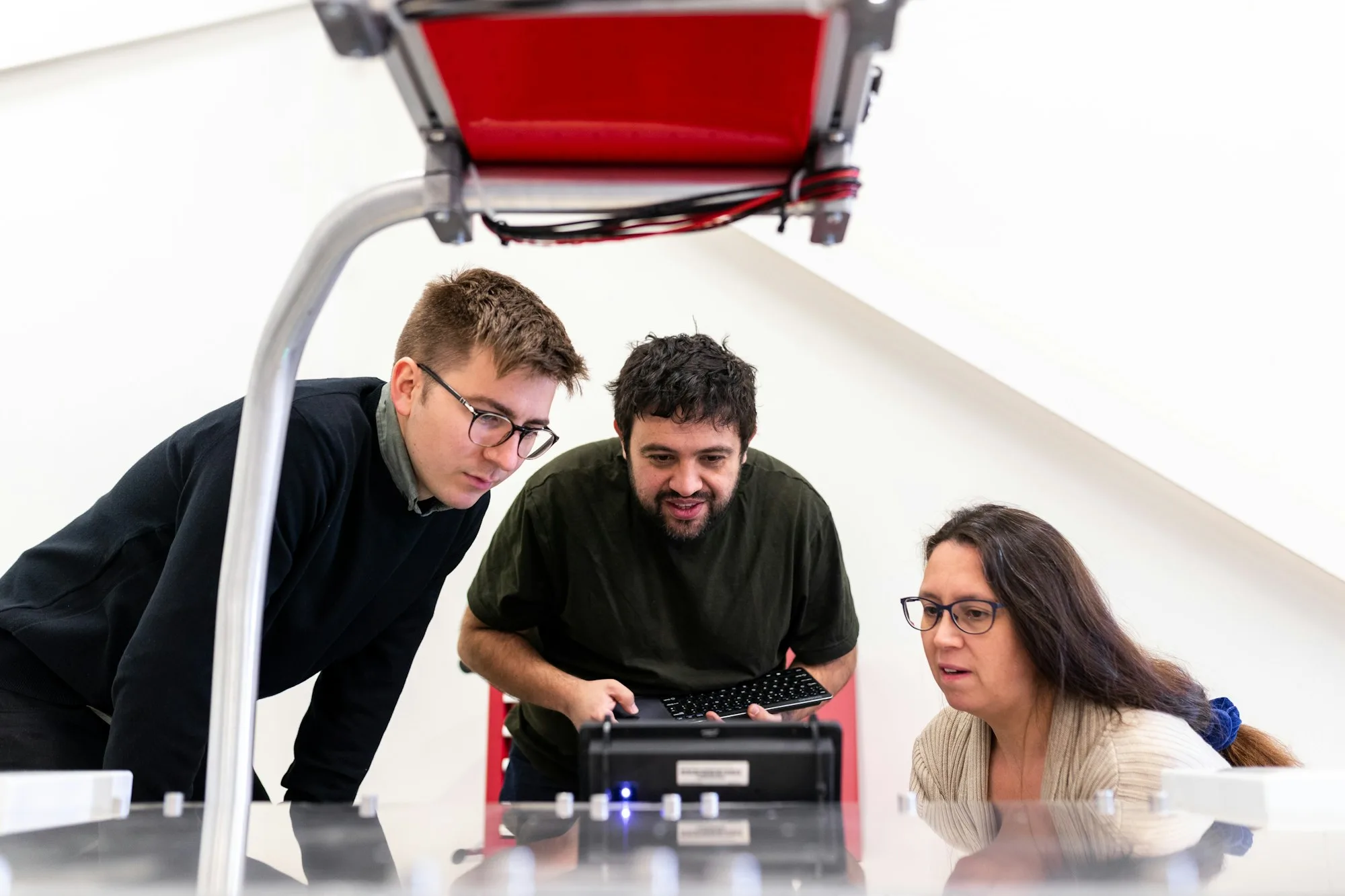 A group of engineers reviewing an agricultural robotics system