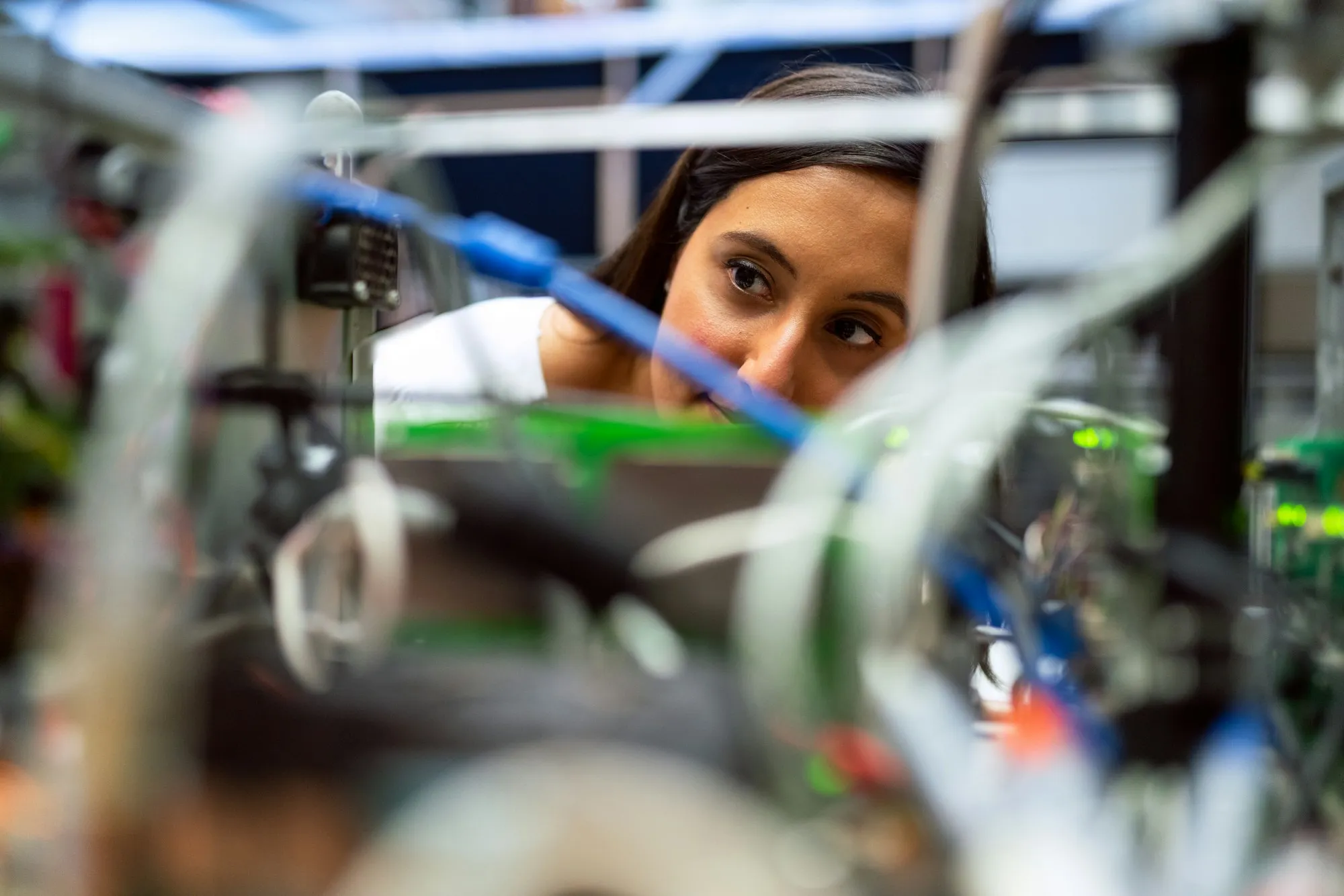 An engineer inspecting components in a laboratory