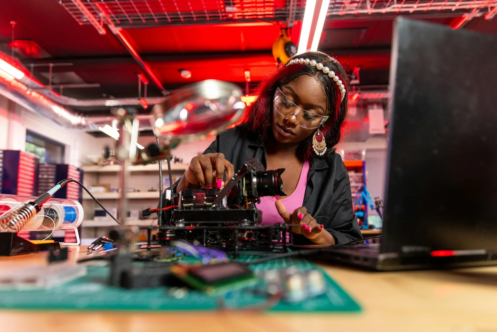 An engineer assembling electronic equipment at a workbench