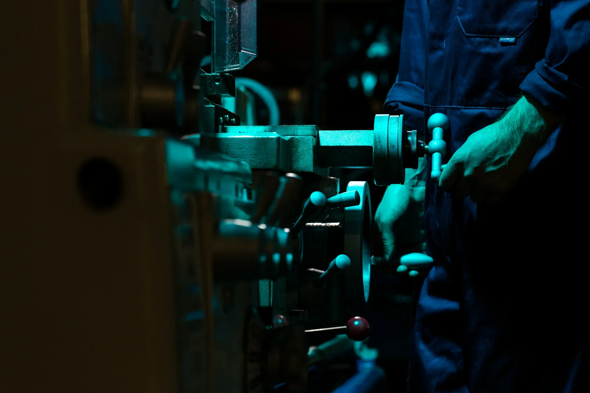 An engineer assembling agricultural robotics in a workshop