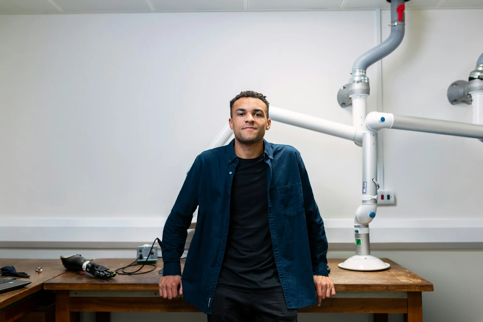 A mechanical engineer standing in a workshop